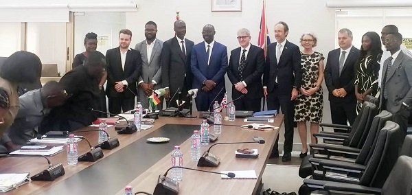 • Dr Forson (middle) with Mr John Humphrey (sixth from right) and other stakeholders after the signing ceremony