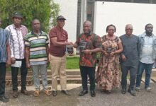 • Mr Gunu (fifth from right) receiving a packaged coffee from Mr Benjamine Atidjah