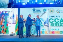 • Dr Abdul Rashid Hassan Pelpuo (right) and others holding the flag during the programme