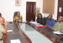 Mrs Emelia Arthur (head of table) addressing the press conference. Photo: Ebo Gorman