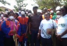 Dr.Issaka Sam Suraj (middle) with other officials after the clean-up exercise