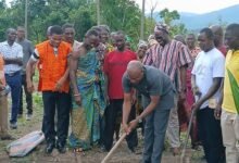 Dr Sam Issaka Suraj breaking the ground for work to commence on the project. With him are other dignitaries at the programme