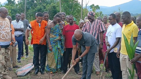 Dr Sam Issaka Suraj breaking the ground for work to commence on the project. With him are other dignitaries at the programme