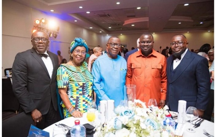 Dr Paul Fynn (middle), Mr Albert Kwabena Dwumfour , President of Ghana Journalists Association (second from right ) and Jacob Fynn ( first from right ) and others at the launch
