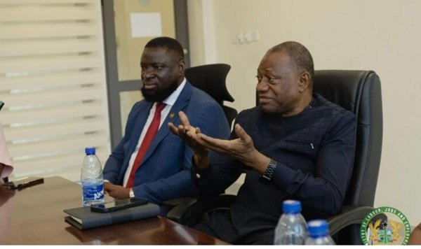 • Dr Pelpuo (right) speaking at the event