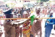 ACFO Osafo Affum, Mr Bobobee, Kyidomhene of the Boso Traditional Area, Nana Akuamoah Kwaw II, cutting the tape to commission the new Fire station