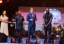 • Mr Landshoeft (middle) presenting a citation to Roman Father (right), Manager of Daddy Lumba at the event