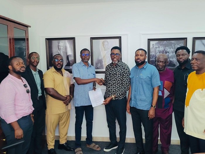 • Mr Awal (fourth from left) with Mr Obeng (fifth from right) after signing the MoU