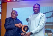 • Godwin Bobobee, DCE, Asuogyaman, receiving his award from Mr Simon Osei-Mensah, former Ashanti Regional Minister