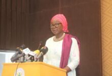 • Commissioner Janet Ramatoulie Sallah-Njie speaking at the media briefing