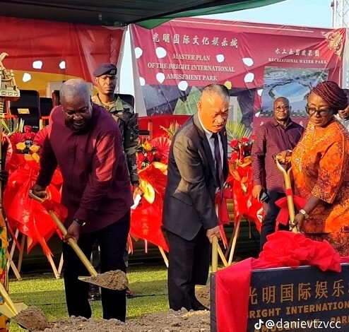 President Mahama (left) with ZhengXiangming (middle) and Ms Dzifa Gomashie cutting the sod for work to begin