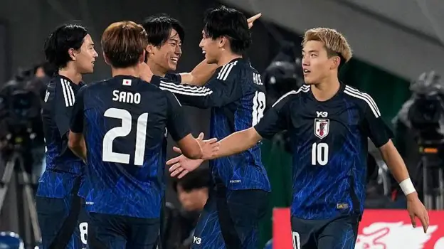 • Japanese players celebrating their victory