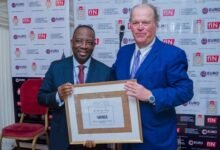 • Mr Alex Dadey (left) receiving the award