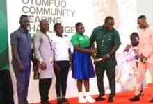 • Alhaji Sedik (second right) presenting Gh¢5,000 cash award to Miss Kokor (fourth left)