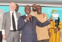 Mr Haruna Iddrisu launching the book. With him include the authors Prof. Kwame Akyeampong (right) and Dr Sean Higgins. Photo: Ebo Gorman