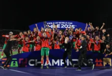 • Morocco players celebrate with the trophy after the victory