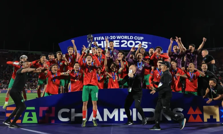 • Morocco players celebrate with the trophy after the victory