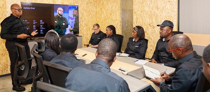 • Mr Salifu (left) interacting with newly recruited staff of the Cote d'Iviore office
