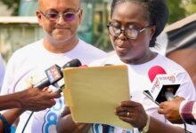 • Mrs Akosua Okyere-Badoo delivering a speech. With her is Mr Zia Choudhury