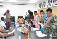 Mr Thomas Thompson (left) Director General, Internal Audit Agency swearing in the new NAFCO audit committee members Photo Seth Osabukle