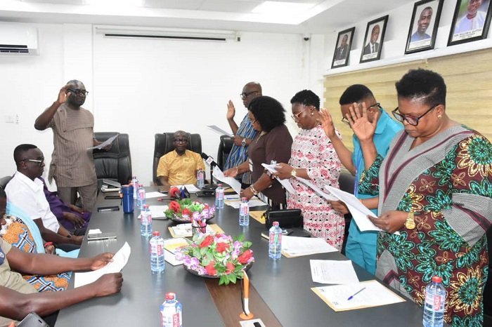 Mr Thomas Thompson (left) Director General, Internal Audit Agency swearing in the new NAFCO audit committee members Photo Seth Osabukle