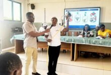 • Mrs. Budu Nyarko (right) during an outreach programme with the students
