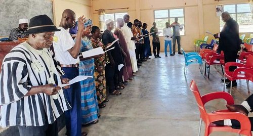 • Mr Anthony Ziniel (infront) swearing in the committee members