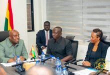 • Nyarko-Ampem (left) speaking at the meeting