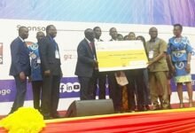 • Mr Adjetey (right) presenting dummy cheque to the winners