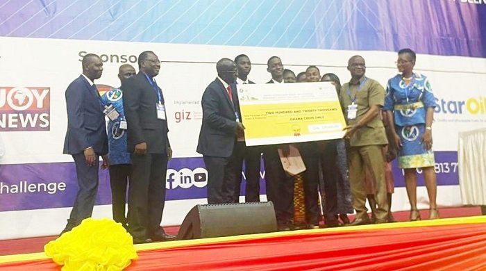 • Mr Adjetey (right) presenting dummy cheque to the winners