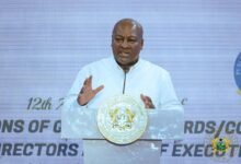• President Mahama (inset) addressing participants at the event