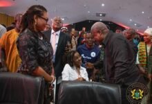 • President Mahama interacting with a person with disability at the launch