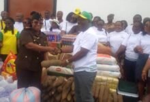 • Mr Divine Akuaku (right) presenting the items to the Officer In Charge of the Female ward, Chief Superintendent Millicent Okity