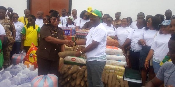 • Mr Divine Akuaku (right) presenting the items to the Officer In Charge of the Female ward, Chief Superintendent Millicent Okity