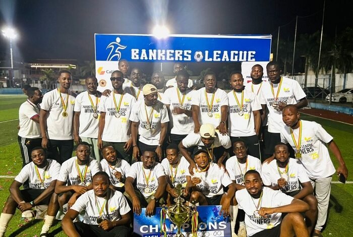 • Players of Team GCB Bank PLC celebrate with the trophy