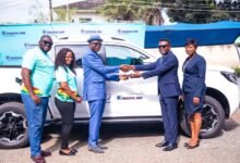 • Dr Addai-Poku (third from left) presenting the keys to Ms Grace Duah