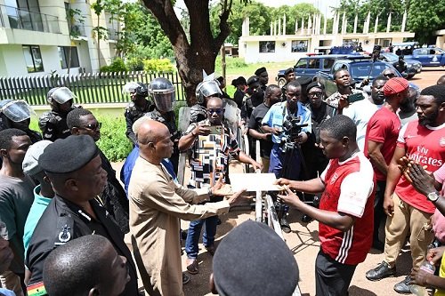 • Mr Ali Adolf (left) receiving the petition