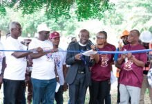 • Rev. Dr. Ken Obeng is joined by other executives to cut the sod for the construction of the sports complex