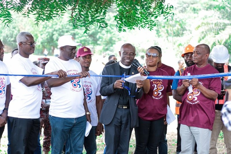 • Rev. Dr. Ken Obeng is joined by other executives to cut the sod for the construction of the sports complex