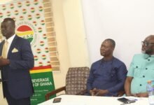 Rev. John Awuni (standing) addressing the press conference. With him include Mr Joseph Obeng (right) GUTA President Photo: Ebo Gorman