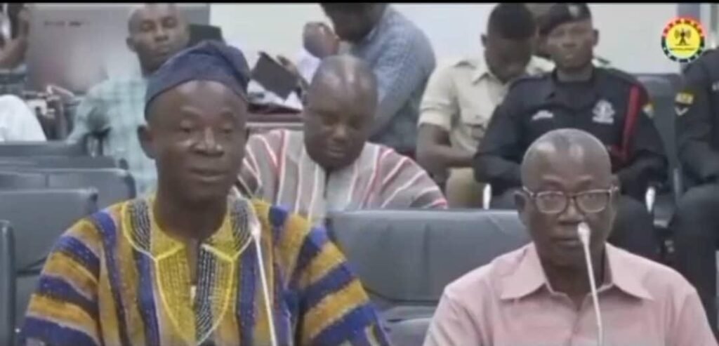 Mr Alhassan Fusheini (in smock) answering questions before the Committee on Local Government and Rural Development