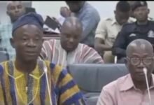 Mr Alhassan Fusheini (in smock) answering questions before the Committee on Local Government and Rural Development