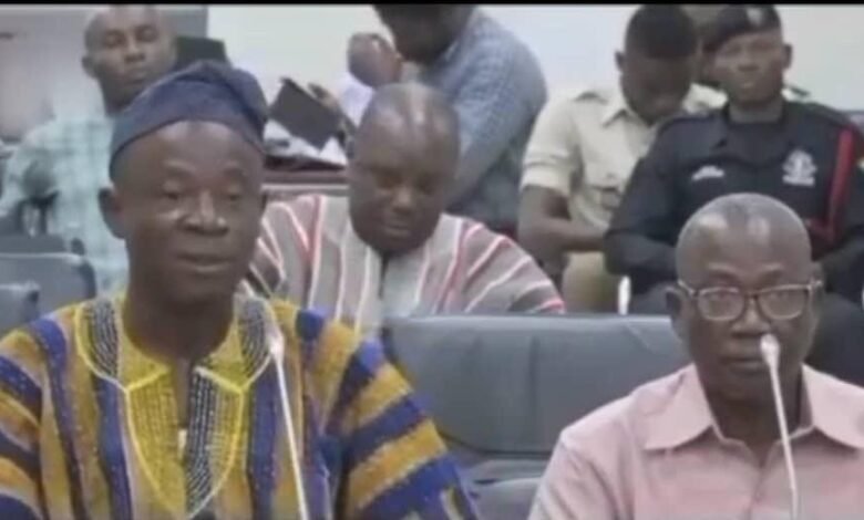 Mr Alhassan Fusheini (in smock) answering questions before the Committee on Local Government and Rural Development