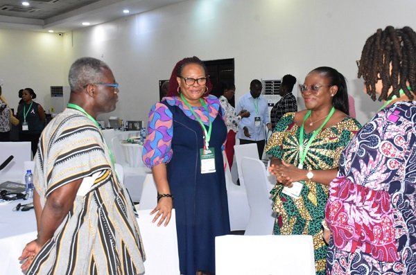 Dr Amoah (second from right) interacting with Dr Charles Abugre, Ms Mary Awelana Addah (second from left), Exe.Dir TI-Ghana and Mrs Monique Cooper-Liverpool (right), MD, Petra Resources,Liberia Photo: Seth Osabukle