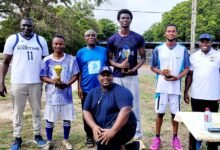 • Some management members, staff and students (with trophies) after the event