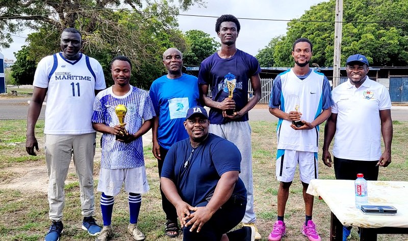 • Some management members, staff and students (with trophies) after the event