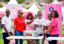 • Officials of the two institutions with the sewing machines