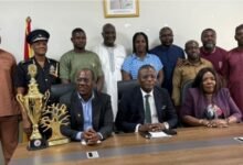 • The Minister with members of the Committee