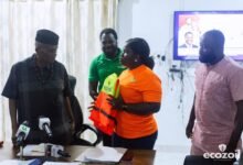 • Ms Yaa Ofriwaa presenting a jacket to Mr Gyapong