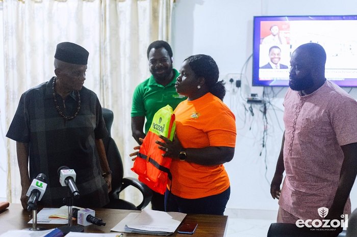 • Ms Yaa Ofriwaa presenting a jacket to Mr Gyapong